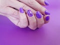 Hands manicure violet polish trendy design paper fashionable glamour minimal