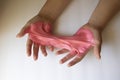 Hands Manipulating Pink Slime