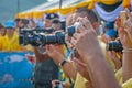 The hands of many photographers and the camera Royalty Free Stock Photo