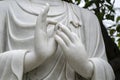 Hands marble Buddha statues in a Buddhist temple in the city of Danang, Vietnam. Closeup Royalty Free Stock Photo