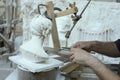 Hands of marble sculptor operating traditional three-dimensional engraving-machine , Carrara, Italy