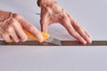 Hands marking a white board, ruller and pencil on a green mat Royalty Free Stock Photo