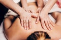 4 hands massage - two masseurs work simultaneously on the patient back Royalty Free Stock Photo