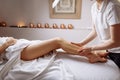Hands massaging human calf muscle.Therapist applying pressure on leg