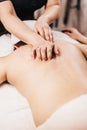 Hands of a masseuse on a female back during work - spa treatments for female beauty and health Royalty Free Stock Photo