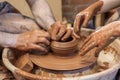 hands of a master potter and a child making dishes. A lesson in a pottery workshop. hands of a potter, creating an Royalty Free Stock Photo