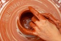 Hands of a master potter in clay Close-up Royalty Free Stock Photo