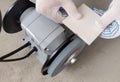 Processing tile or porcelain tiles with a grinder.