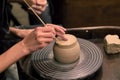 The hands of the master working with clay on a potter`s wheel, c Royalty Free Stock Photo