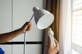 Hands mechanic changing with new LED lamp light bulb,Power saving concept