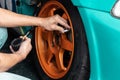 Hands of mechanic man checking tire air pressure. Maintenance car Royalty Free Stock Photo