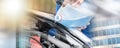 Hands of mechanic pouring windshield washer fluid in a car; multiple exposure