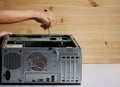Hands of a mechanic with a screwdriver repairing and assembling desktop computer internal parts Royalty Free Stock Photo