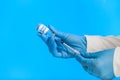 Hands of a medic in gloves are filling a syringe Royalty Free Stock Photo