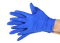 Hands of a medic wearing blue latex gloves, white background