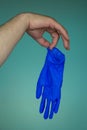 Hands in medical gloves on a blue background. Disease Protection Concept. Pandemic Protection Concept. Stop coronovirus