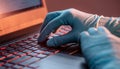 Hands in medical gloves type on a laptop keyboard in close-up. Concept of protection while working in quarantine Royalty Free Stock Photo