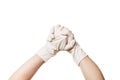 Hands in a medical sterile gloves shows hands together gesture of support.