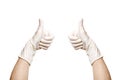 Hands in a medical sterile gloves shows thumbs up approving gesture of consent. Royalty Free Stock Photo