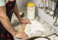 Hands of men prepared, wooden rolling pin, dough, flour Royalty Free Stock Photo