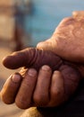 The hands of men resting after a grueling work