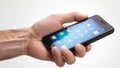 Hands Mobile Cel Phone. A mans hand using a touchscreen call phone with a blank screen