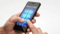 Hands Mobile Cel Phone. A mans hand using a touchscreen