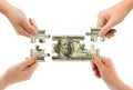 Hands and money puzzle Royalty Free Stock Photo