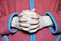 The hands of a monk, folded in a prayer posture Royalty Free Stock Photo