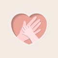 Hands of mother and baby in heart shaped paper art Royalty Free Stock Photo