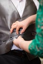 Hands of mother helping his son in his wedding day Royalty Free Stock Photo