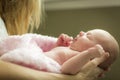 Hands of Mother Holding Her Newborn Baby Girl Royalty Free Stock Photo