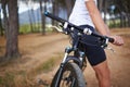 Hands, mountain bike and forest for exercise relax or extreme sport, challenge or journey. Cyclist, gears and off road Royalty Free Stock Photo