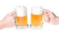 Hands with mug of beer cheers