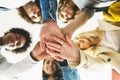 Hands of a multi-ethnic group of friends joined together as a sign of support and teamwork. Royalty Free Stock Photo