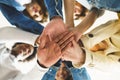 Hands of a multi-ethnic group of friends joined together as a sign of support and teamwork. Royalty Free Stock Photo