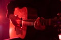 Hands of a musician playing an acoustic guitar with metal strings. Hobby. Musical instruments Royalty Free Stock Photo