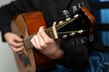 Hands of a musician playing an acoustic guitar with metal strings. Hobby. Musical instruments Royalty Free Stock Photo