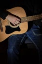 Hands of a musician playing an acoustic guitar with metal strings. Hobby. Musical instruments. Selective focus Royalty Free Stock Photo