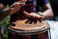 Hands of a musician playing the atabaque. Feeling of power and speed