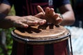 Hands of a musician playing the atabaque. Feeling of power and speed