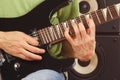 Hands of musician put guitar chords close up Royalty Free Stock Photo