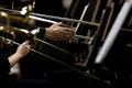 Hands of musicians played the trombone in the orchestra Royalty Free Stock Photo