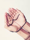 Hands with Muslim Prayer Beads