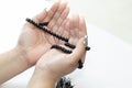 Hands of the Muslim women praying with a beat white background, Muslim woman raising her hand to pray, Young Women Prays to God