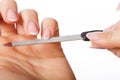 Hands with nailfile Royalty Free Stock Photo