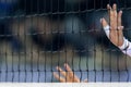 Hands on net during the Hellenic Volleyball League game