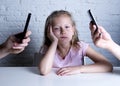 Hands of network addict parents using mobile phone neglecting little sad ignored daughter bored