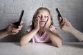 Hands of network addict parents using mobile phone neglecting little sad ignored daughter bored