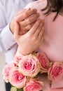 Newlyweds ` hands with rings. Wedding bouquet on the background of the hands of the bride and groom with a gold ring Royalty Free Stock Photo